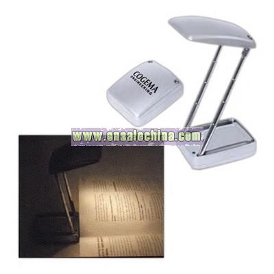 Silver collapsible reading light with flashlight