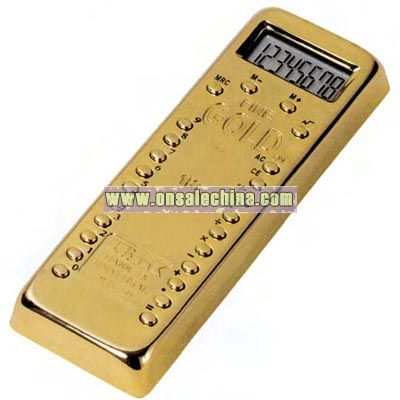 Eight digit calculator and paper weight in the shape of gold bar