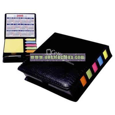 Leather look case of sticky notes with calendar and pen