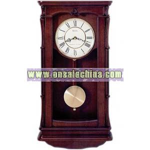 Wall clock in solid wood case