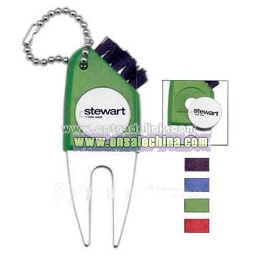 Golf tool that includes divot repair tool & ball marker