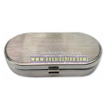 Oval metal pill box with 2 divisions