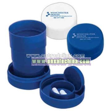 Travel cup with pill compartment