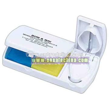 Two compartment pill box with safety cutter