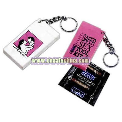 Key chain with condom in secret compartment