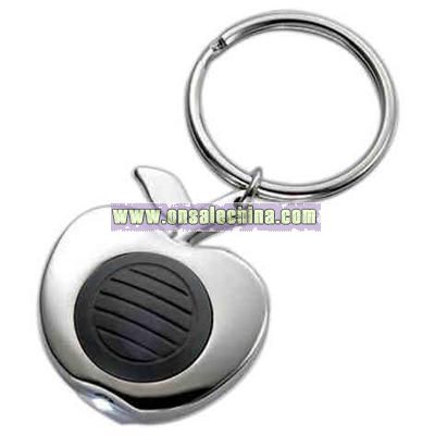 Apple shape silver key ring with white beam of light