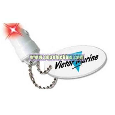 Light up floatable keychain with water activated red LED
