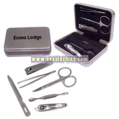 Six piece manicure set in silver tin hinged box