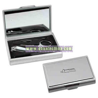 Manicure set in aluminum case with mirror under flap