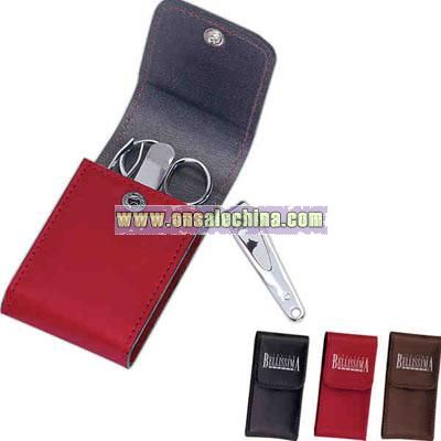 Four piece manicure set in a bonded leather kit