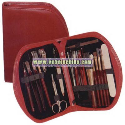 Women's red simulated leather cosmetic kit with manicure and makeup sets