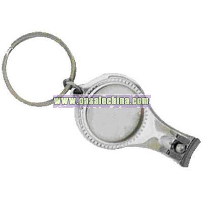 Key chain with nail clipper and bottle opener