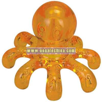 Translucent orange octopus shaped massager