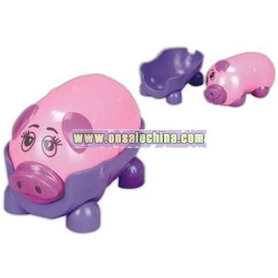 Battery operated pig shaped massager with its own stand