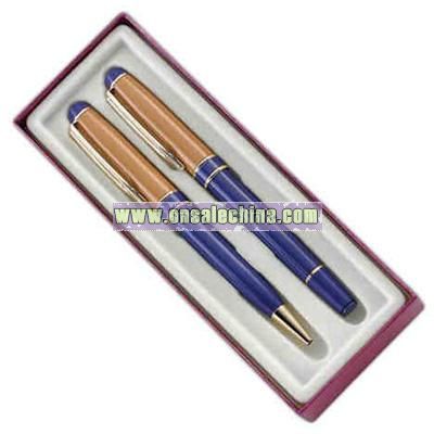 Blue and brown ballpoint and rollerball pen in cardboard box