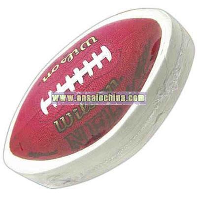 Football shaped compressed t-shirt