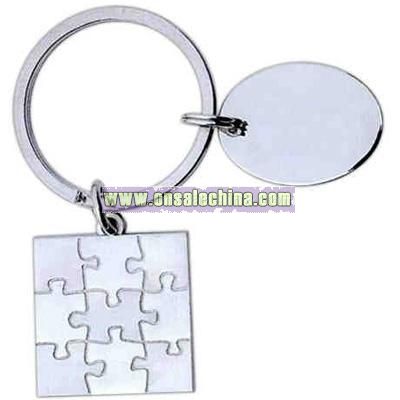 Nickel finished puzzle shape designer key tag with 1