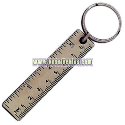 Key holder with miniature ruler