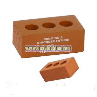 Brick with holes shape stress reliever