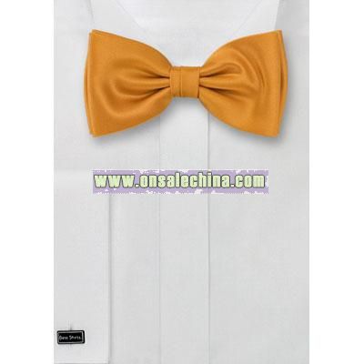 Amber yellow bow tie with elegant golden shine.