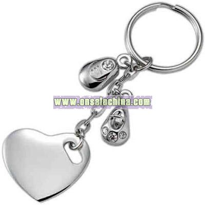 Silver heart key ring with charms.